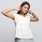 Right View of a Model wearing Off-White Crinkled Cotton Wrap Top