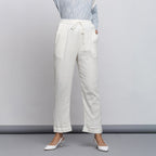 Front View of a Model wearing Off-White Crinkled Cotton Tapered Pant