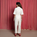 Back View of a Model wearing Off-White Embroidered Cotton Muslin High-Rise Overalls