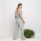 Back View of a Model wearing Off-White Handwoven Cotton Jumpsuit