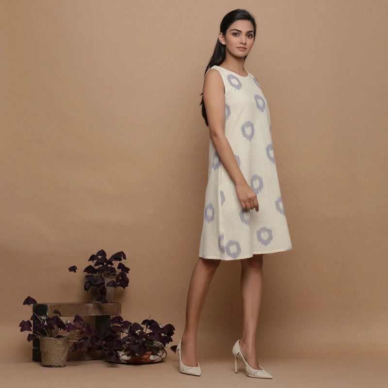 Right View of a Model wearing Off-White Paneled Sleeveless Cotton Dress