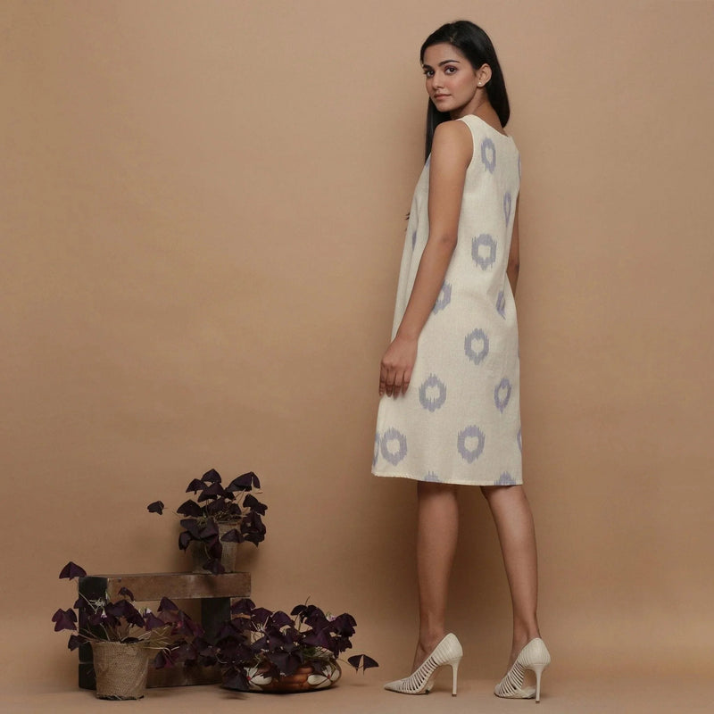 Back View of a Model wearing Off-White Paneled Sleeveless Cotton Dress