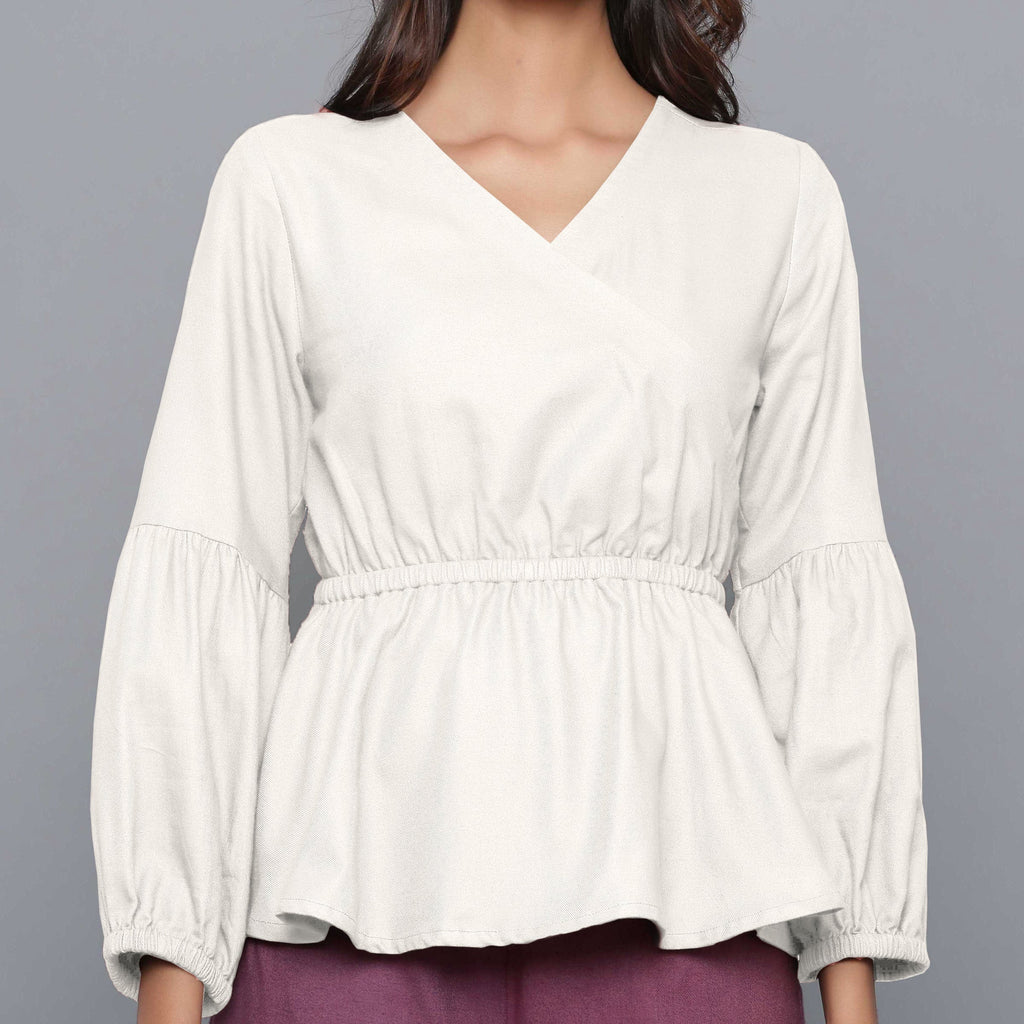 Front Detail of a Model wearing Off-White V-Neck Flannel Peplum Top