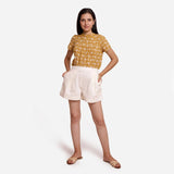 Front View of a Model wearing Off-White Striped Mid-Rise Shorts