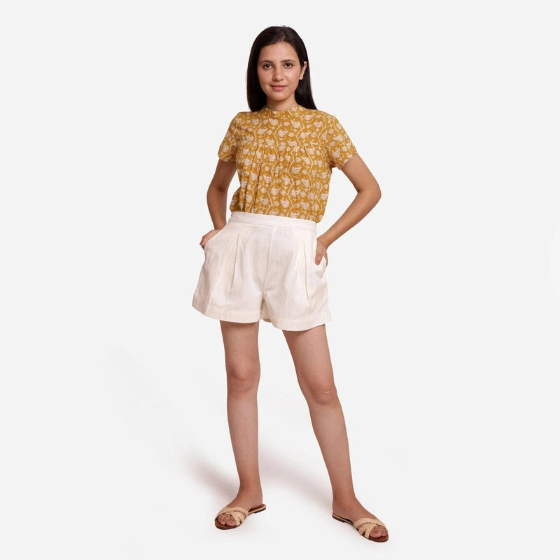 Front View of a Model wearing Off-White Striped Mid-Rise Shorts