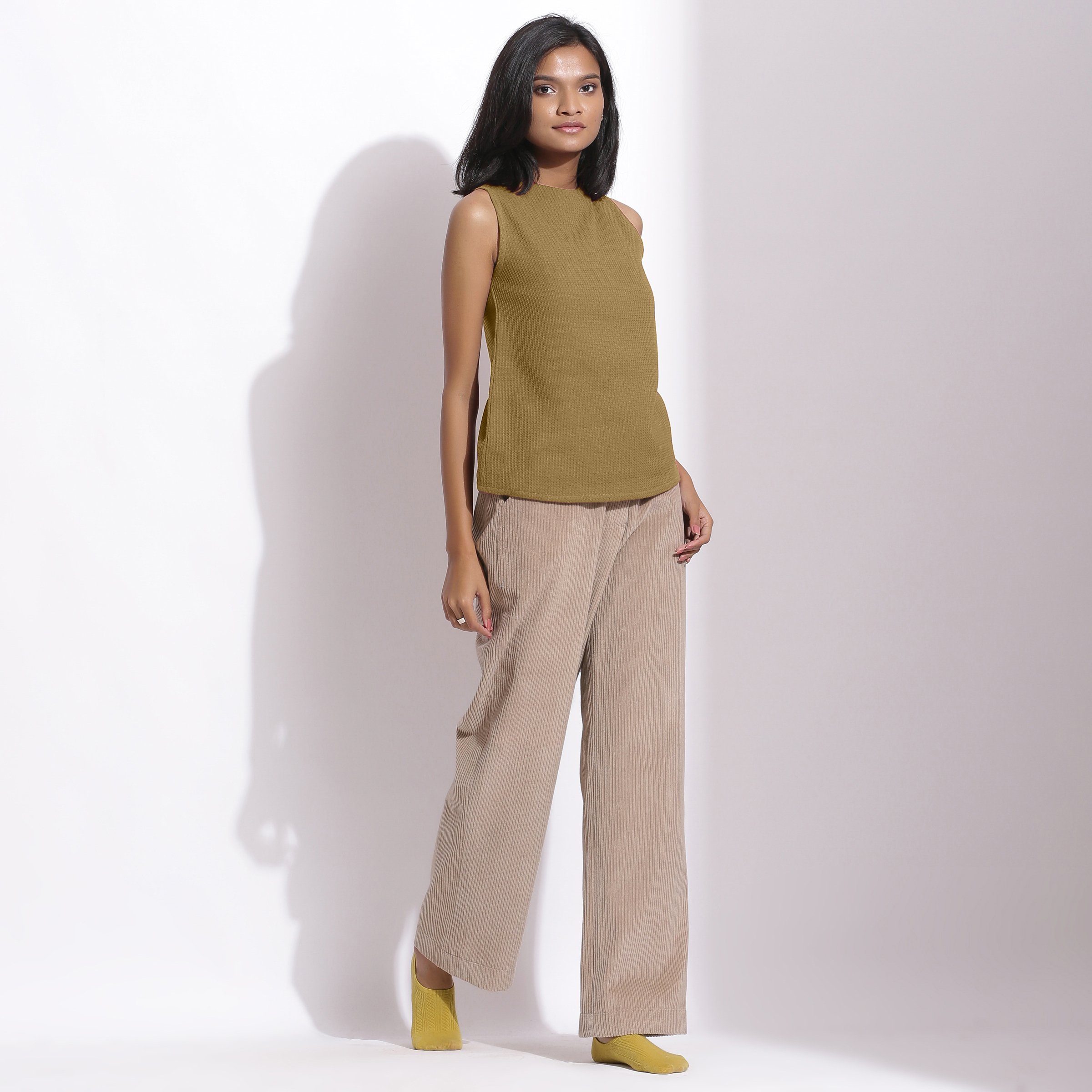 Right View of a Model wearing Olive Cotton Waffle Funnel Neck Top