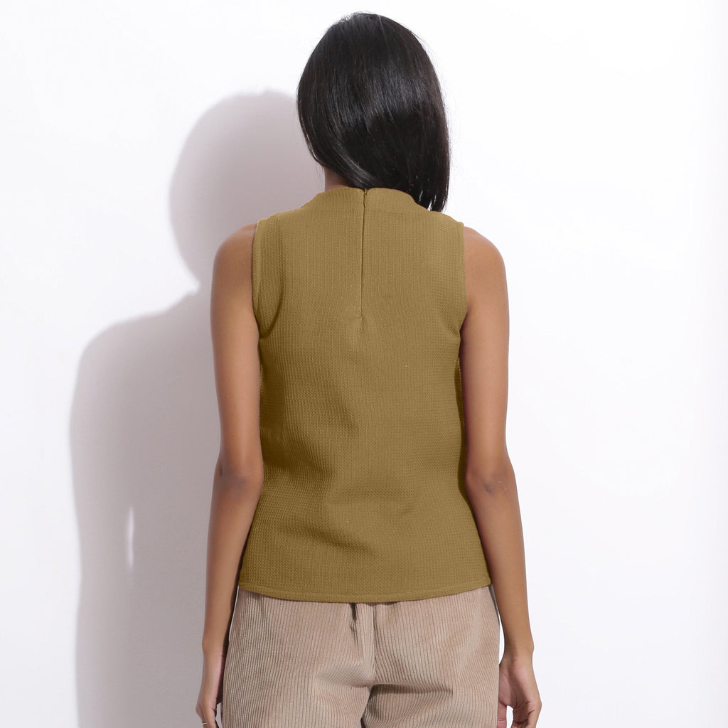 Back View of a Model wearing Olive Cotton Waffle Funnel Neck Top