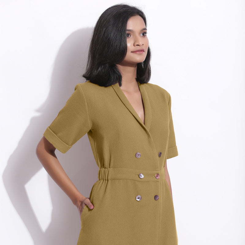 Front Detail of a Model wearing Olive Green Cotton Waffle Knee Length Coat Dress