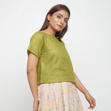 Right View of a Model wearing Olive Green Boat Neck Half Sleeve Cotton Top