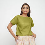 Front View of a Model wearing Olive Green Boat Neck Half Sleeve Cotton Top