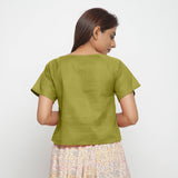 Back View of a Model wearing Olive Green Boat Neck Half Sleeve Cotton Top