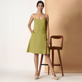 Front View of a Model wearing Olive Green Cotton Flax Strappy Slit Dress