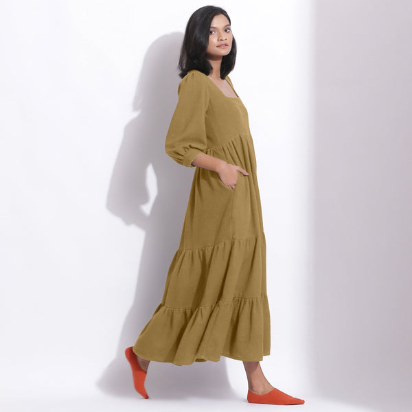 Right View of a Model wearing Olive Green Cotton Honeycomb Waffle Tier Dress