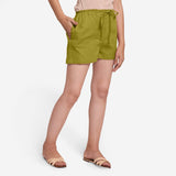 Right View of a Model wearing Olive Green Cotton Straight Shorts