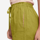 Left Detail View of a Model wearing Olive Green Cotton Straight Shorts