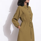 Right Detail of a Model wearing Olive Green Warm Cotton Waffle Knee Length Dress