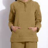 Front Detail of a Model wearing Olive Green Cotton Waffle Hoodie Sweatshirt