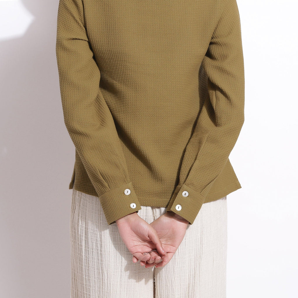 Back Detail of a Model wearing Olive Green Cotton Waffle Polo Shirt