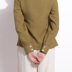 Back Detail of a Model wearing Olive Green Cotton Waffle Polo Shirt