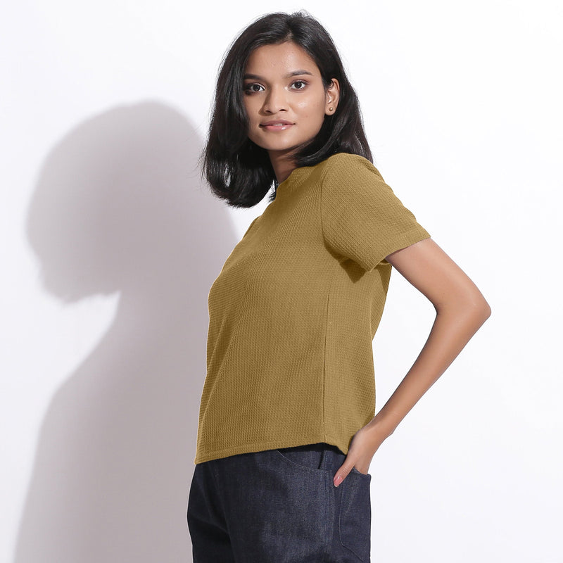 Left View of a Model wearing Olive Green Cotton Waffle Woven T-Shirt