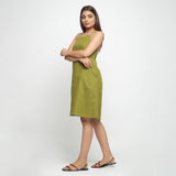 Left View of a Model wearing Olive Green Criss-Cross Cotton A-Line Dress
