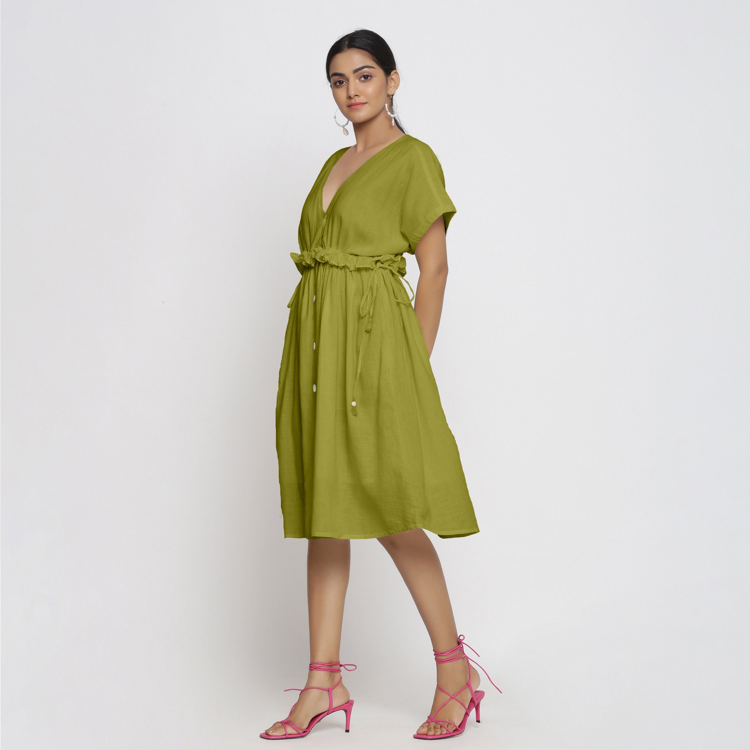 Left View of a Model wearing Olive Green Deep Neck Bohemian Frilled Dress