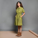 Left View of a Model wearing Olive Green Handspun Cotton Short Safari Dress