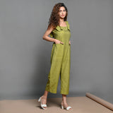 Right View of a Model wearing Olive Green Handspun Cotton Frilled Jumpsuit