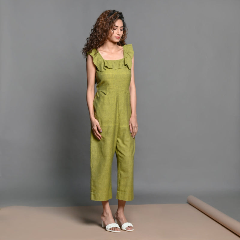 Front View of a Model wearing Olive Green Handspun Cotton Frilled Jumpsuit