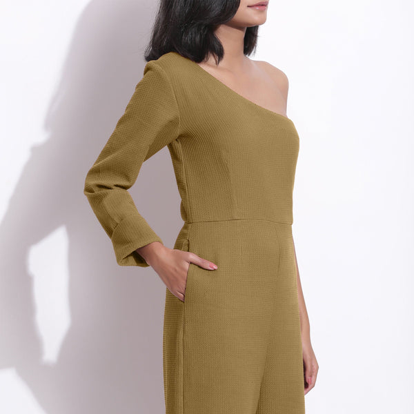 Front Detail of a Model wearing Olive Green Honeycomb One-Shoulder Jumpsuit