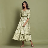 Front View of a Model wearing Olive Green Shibori Asymmetrical Tier Maxi Dress