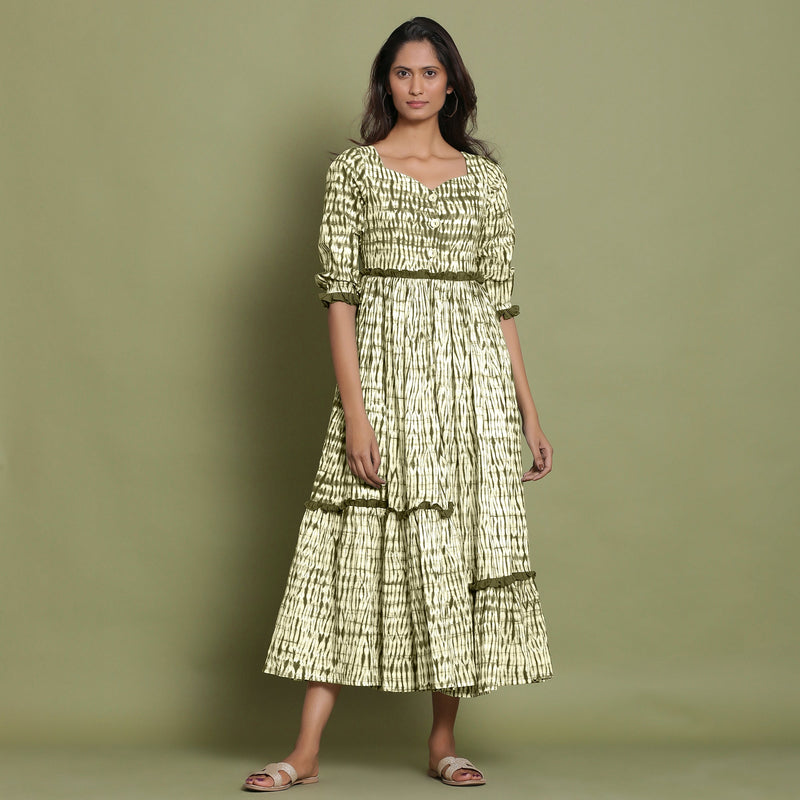 Front View of a Model wearing Olive Green Shibori Asymmetrical Tier Maxi Dress