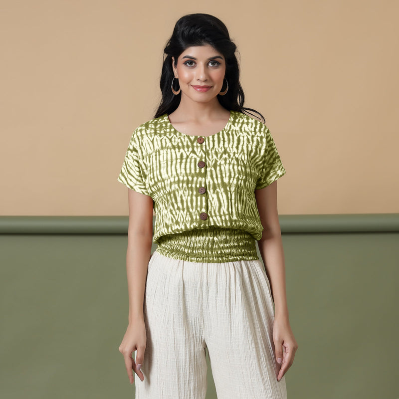 Front View of a Model wearing Olive Green Shibori Button-Down Blouson Top