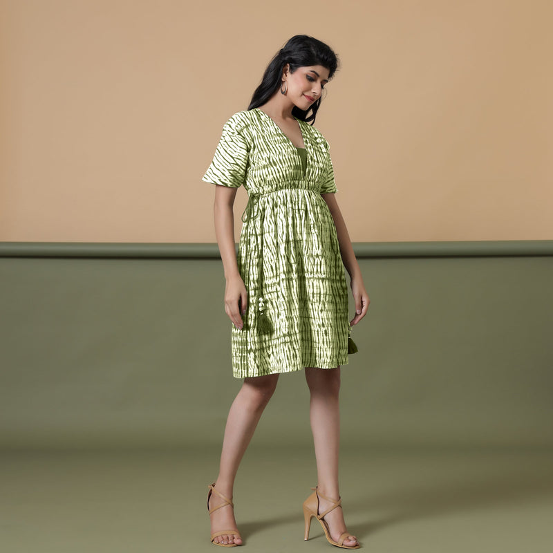 Right View of a Model wearing Olive Green Shibori Drop Shoulder Dress