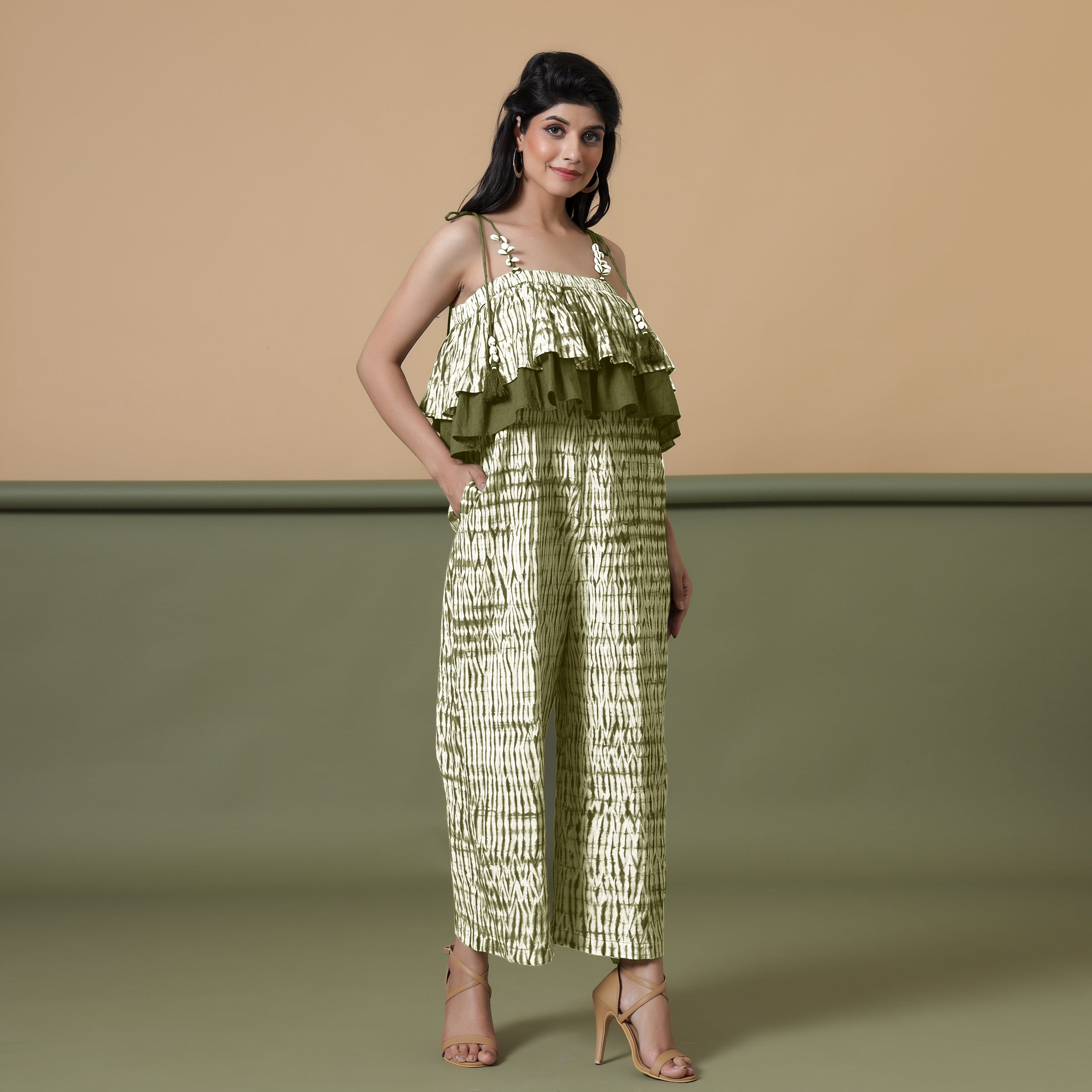 Right View of a Model wearing Olive Green Shibori Frilled Camisole Jumpsuit
