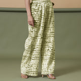 Right View of a Model wearing Olive Green Shibori Paperbag Cotton Pant