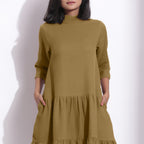Front Detail of a Model wearing Olive Green Waffle High Neck Tier Dress
