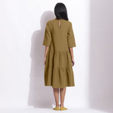 Back View of a Model wearing Olive Green Waffle High Neck Tier Dress