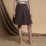 Front View of a Model wearing Orange and Brown Reversible Pleated Flared Skirt