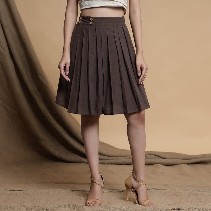 Front View of a Model wearing Orange and Brown Reversible Pleated Flared Skirt