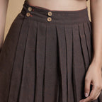 Front Detail of a Model wearing Orange and Brown Reversible Pleated Flared Skirt
