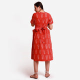 Back View of a Model wearing Orange Dabu Block Print A-Line Midi Dress