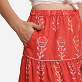 Front Detail of a Model wearing Orange Floral Block Print Cotton Maxi Skirt