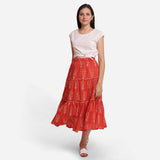 Front View of a Model wearing Orange Floral Block Print Cotton Maxi Skirt