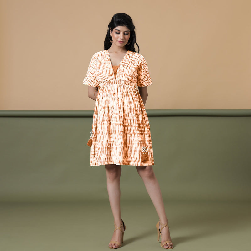 Front View of a Model wearing Orange Green Shibori Drop Shoulder Dress