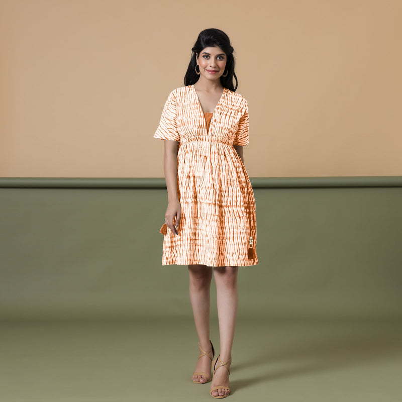 Front View of a Model wearing Orange Green Shibori Drop Shoulder Dress