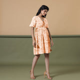 Right View of a Model wearing Orange Green Shibori Drop Shoulder Dress