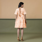 Back View of a Model wearing Orange Green Shibori Drop Shoulder Dress