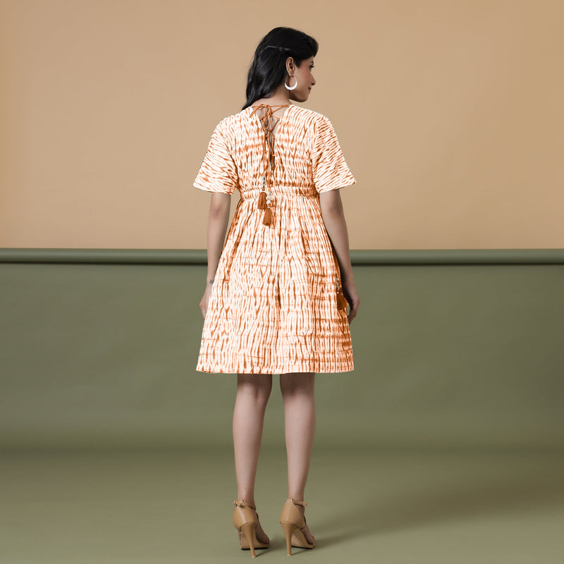 Back View of a Model wearing Orange Green Shibori Drop Shoulder Dress