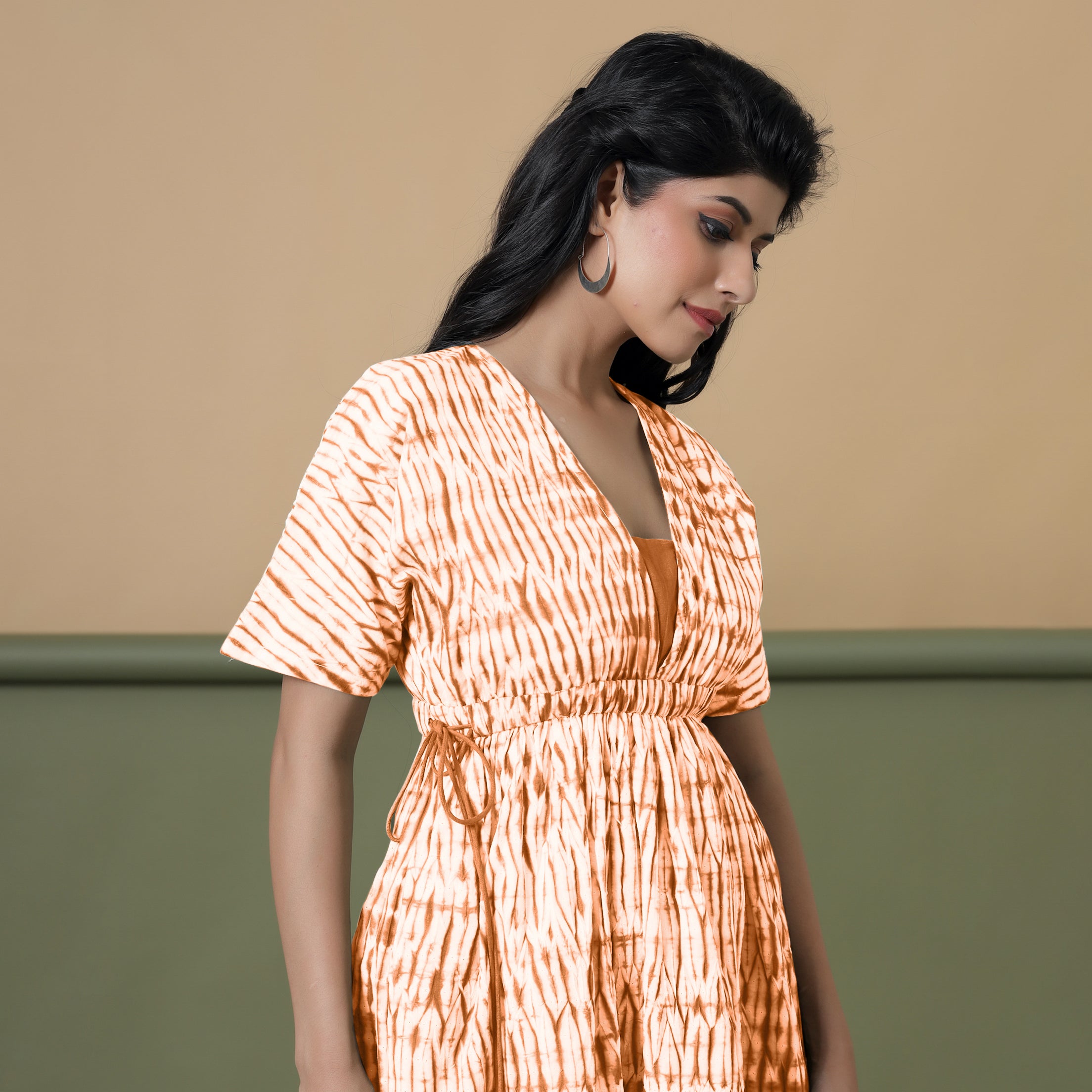 Right View of a Model wearing Orange Green Shibori Drop Shoulder Dress